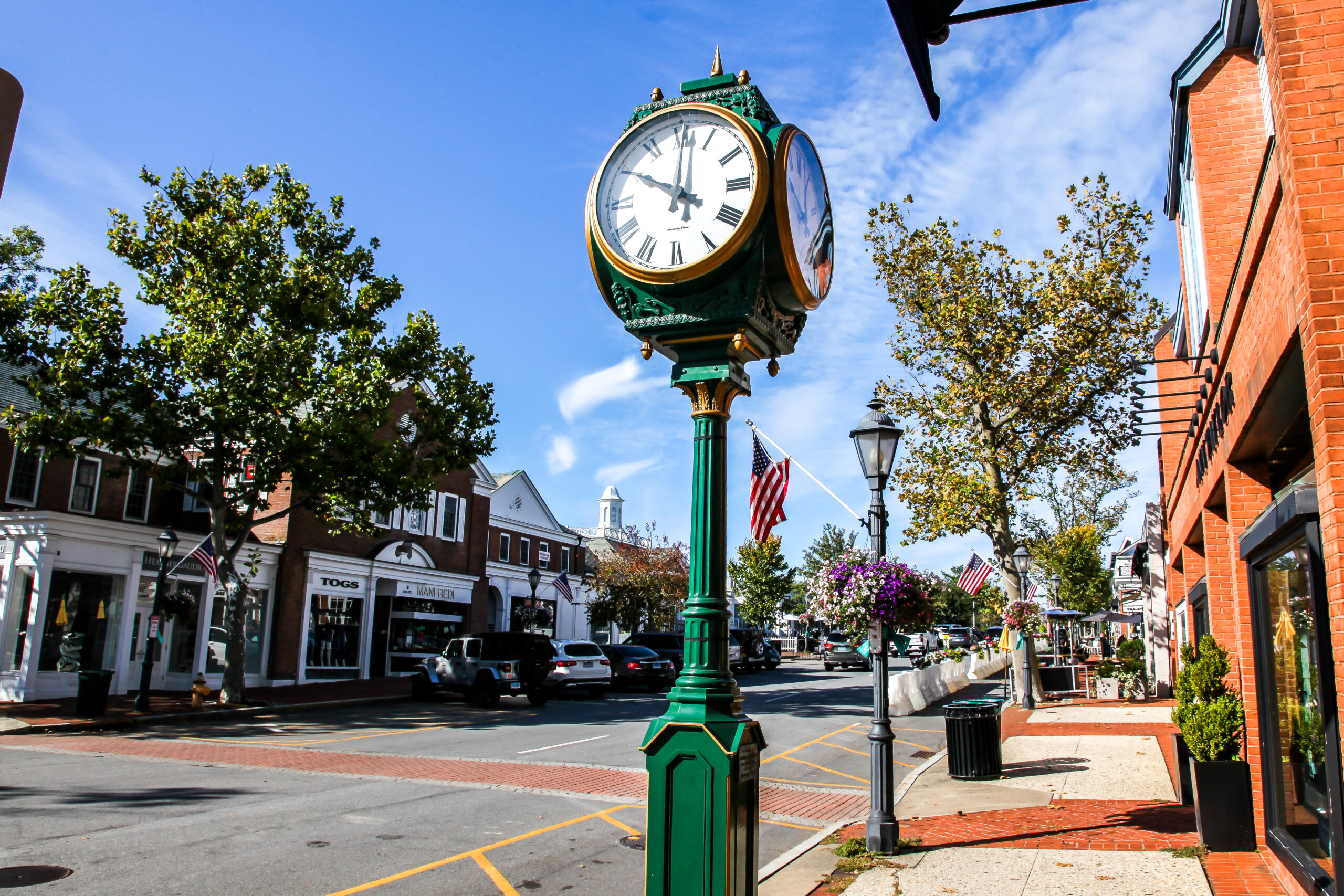 NEW CANAAN, CT, USA OCTOBER 4, 2020: Downtown In Nice Day With Clock, Store Fronts, Restaurant And Blue Sky On Elm Street
